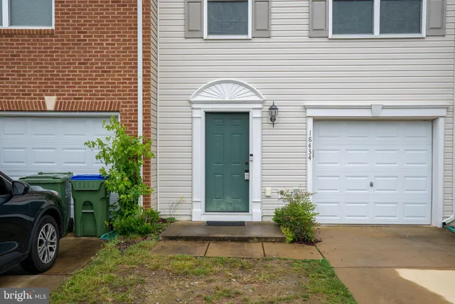 a front view of a house with garage