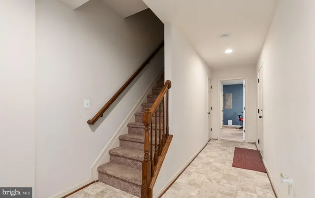 a view of a hallway with staircase