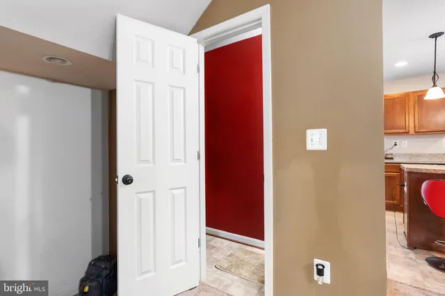 a view of a kitchen with a refrigerator and a stove