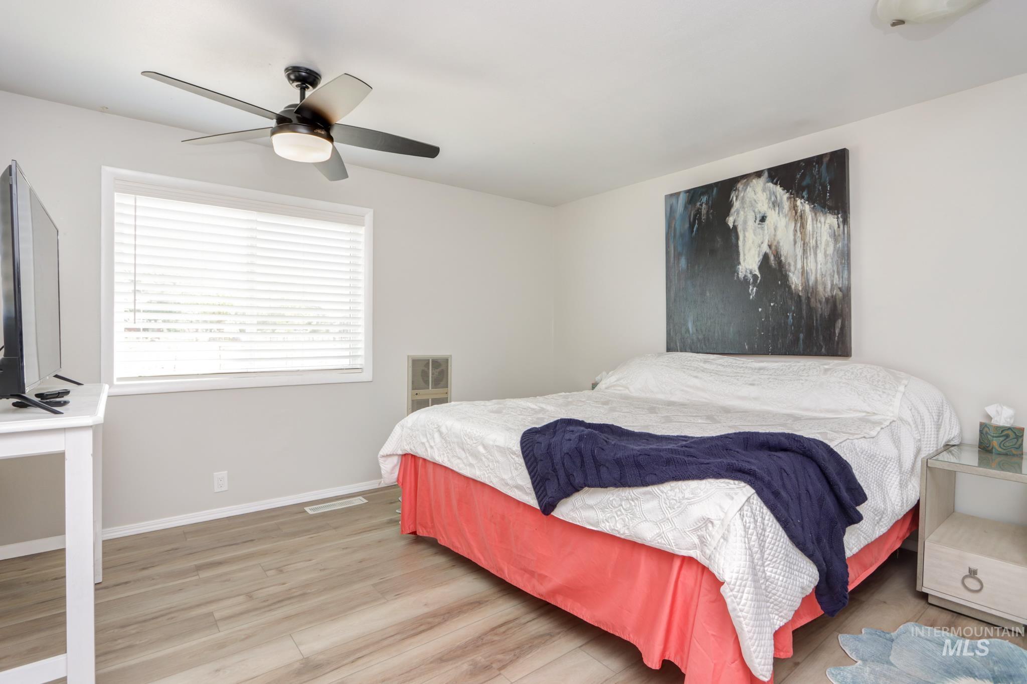 2528 Waterwheel Road Emmett, ID 83617 - Photo 34 of 50 Interior room featuring wood-panel accent wall and light-toned flooring