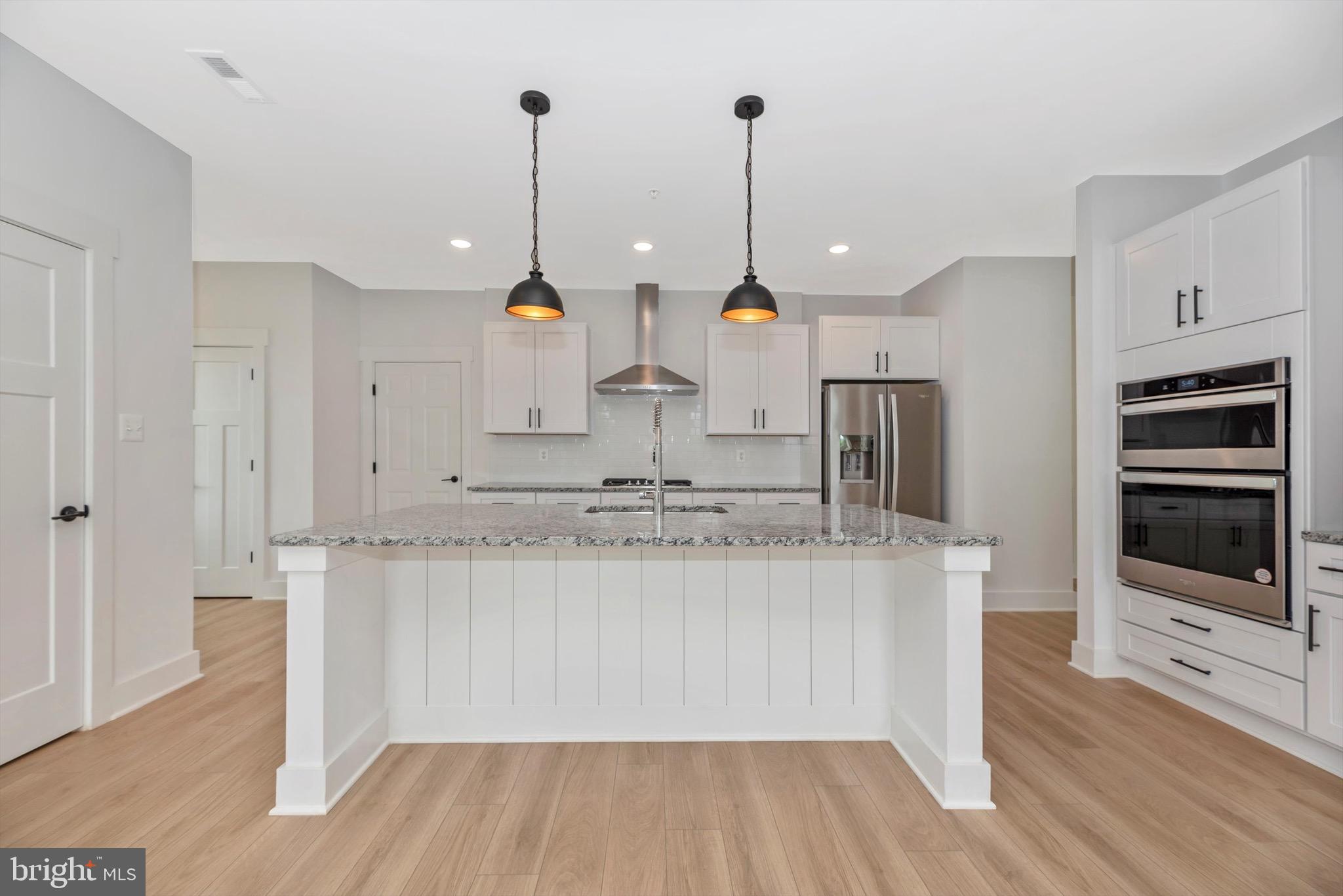 0 Cherryfield Road Fort Washington, MD 20744 - Photo 2 of 8 a kitchen with kitchen island a counter top space appliances and cabinets