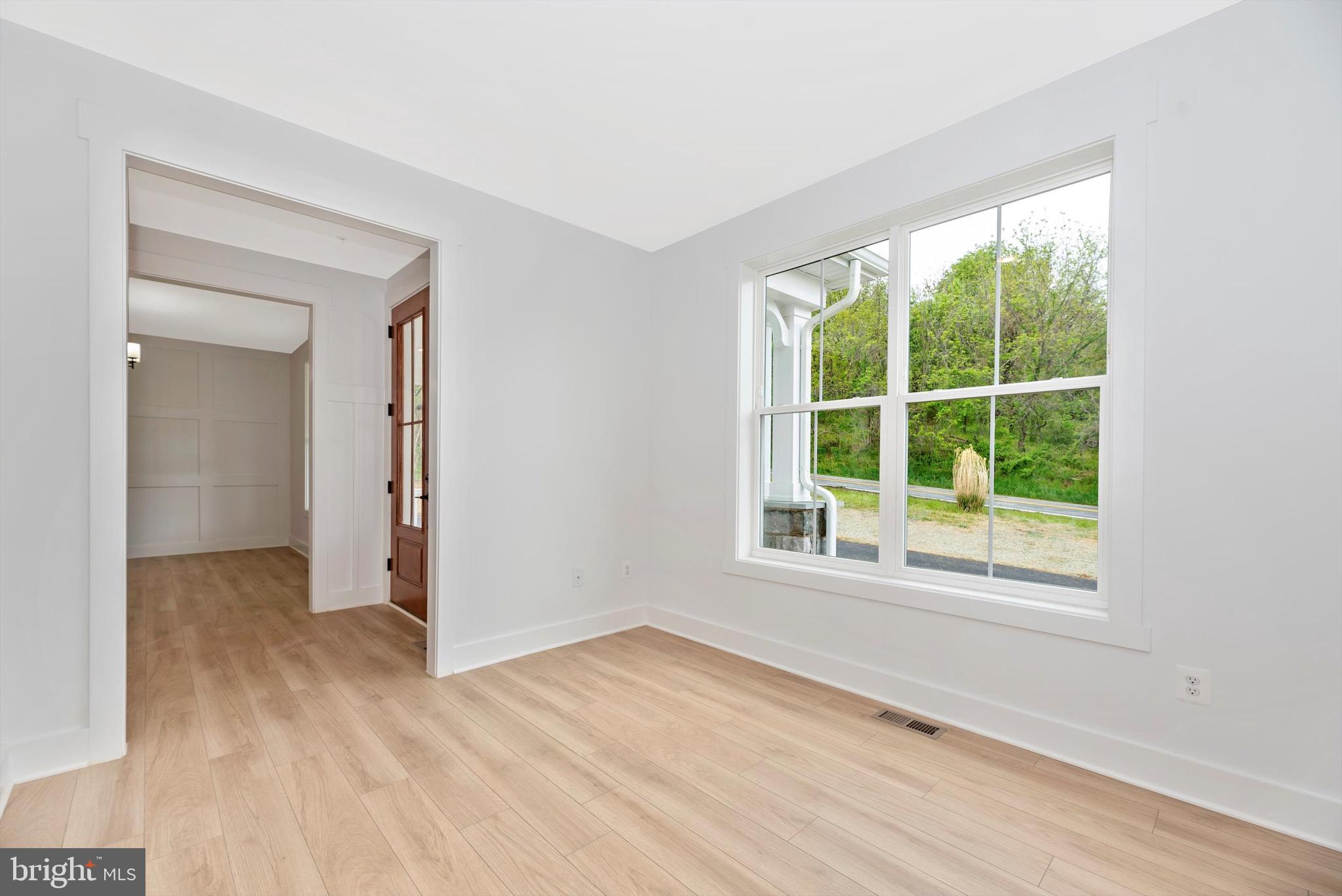 0 Cherryfield Road Fort Washington, MD 20744 - Photo 4 of 8 an empty room with wooden floor and windows