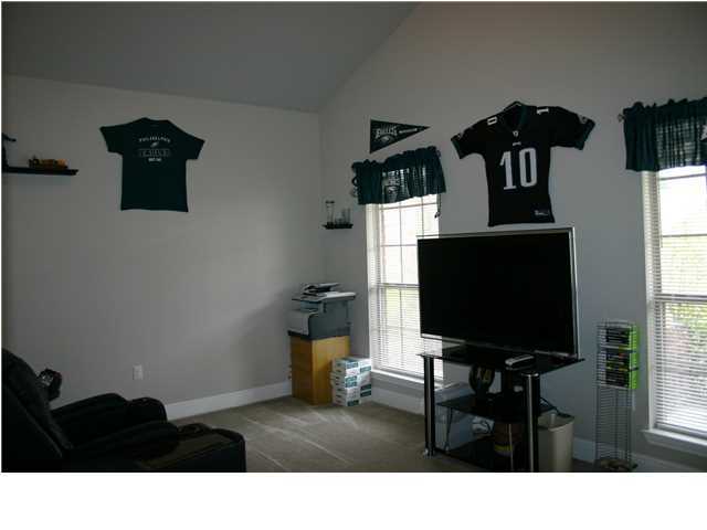 658 Red Fern Road Crestview, FL 32536 - Photo 14 of 20 a living room with furniture and a flat screen tv