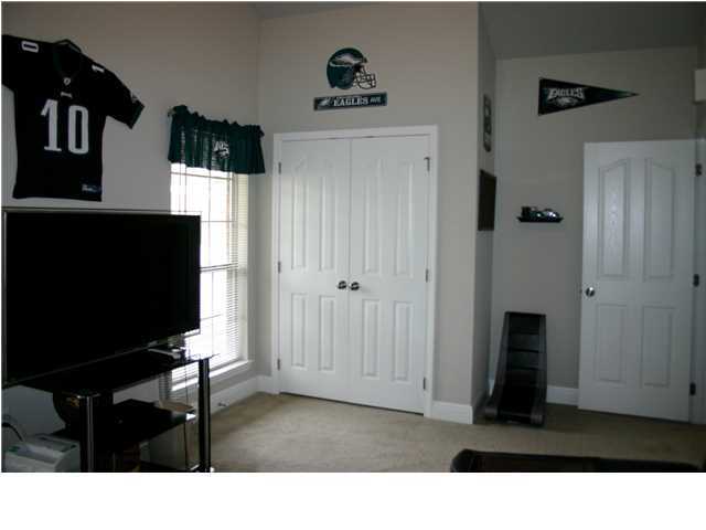 658 Red Fern Road Crestview, FL 32536 - Photo 15 of 20 a living room with furniture and a flat screen tv