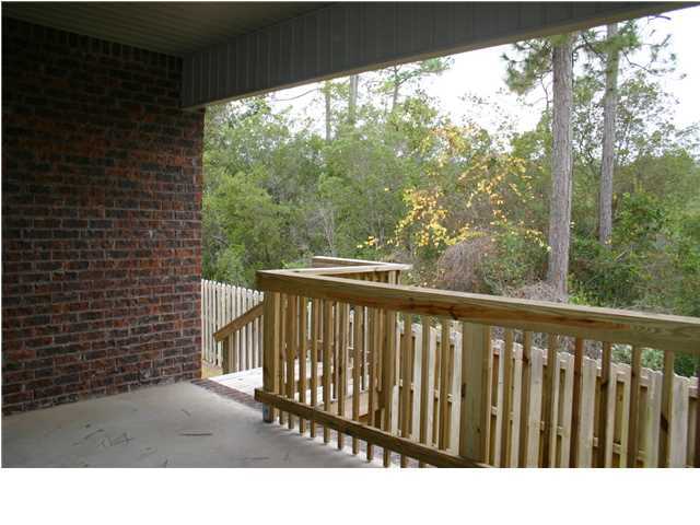 658 Red Fern Road Crestview, FL 32536 - Photo 19 of 20 a view of a balcony with wooden floor