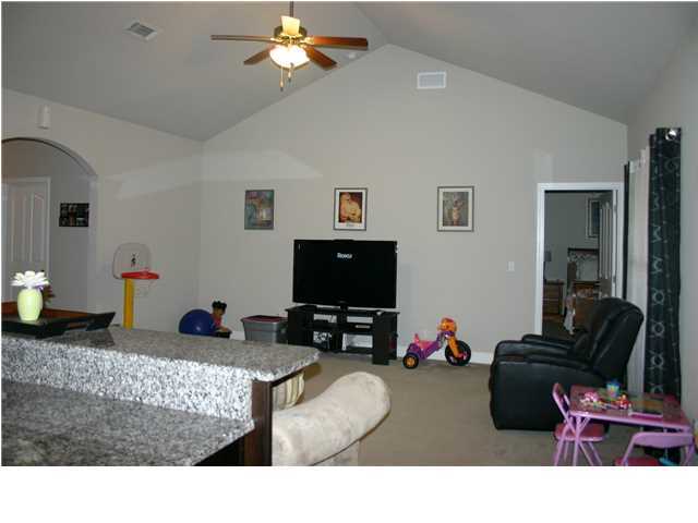 658 Red Fern Road Crestview, FL 32536 - Photo 4 of 20 a living room with furniture and a flat screen tv
