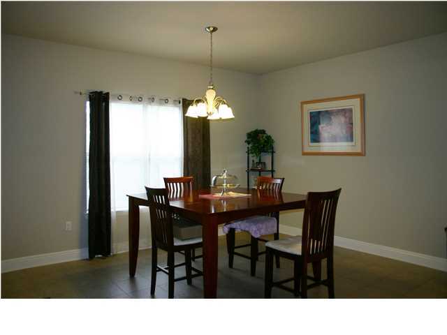658 Red Fern Road Crestview, FL 32536 - Photo 8 of 20 a dining room with a table and chairs