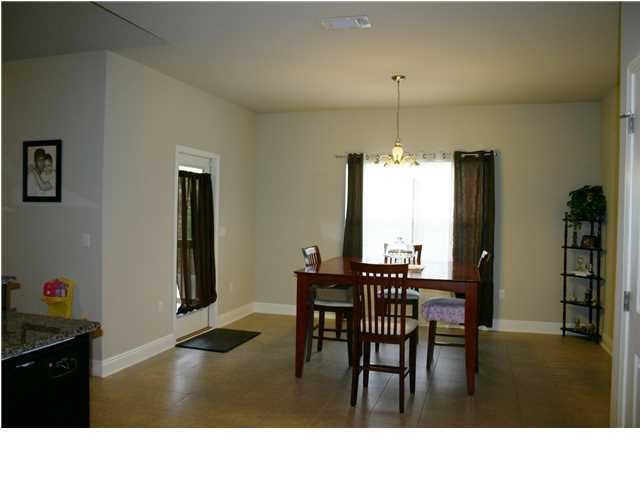 658 Red Fern Road Crestview, FL 32536 - Photo 9 of 20 a kitchen with a table and chairs