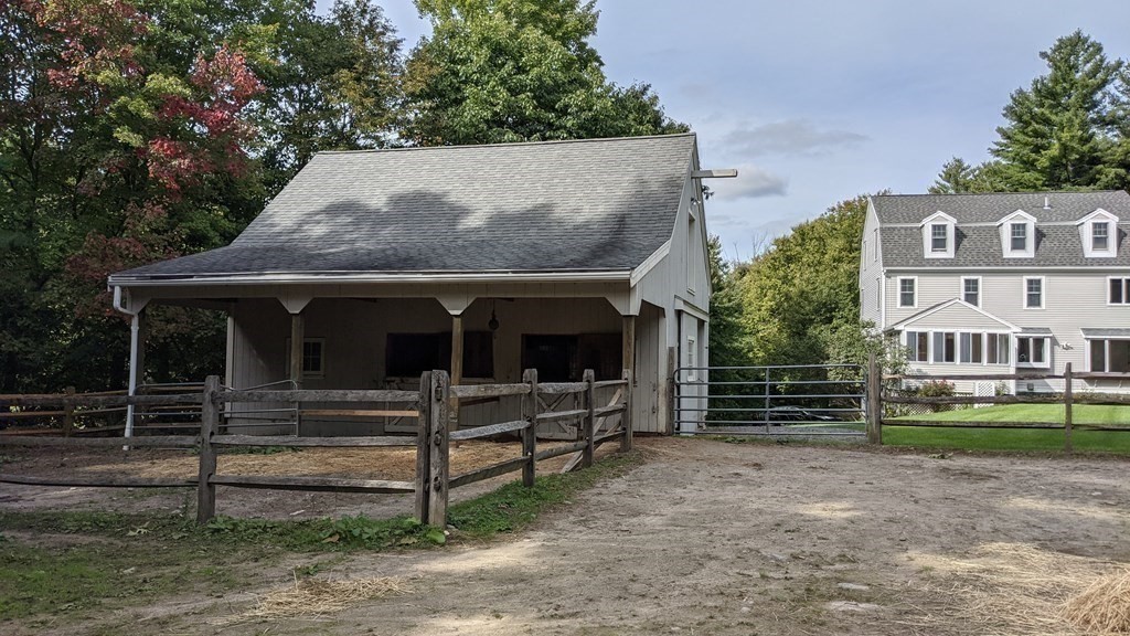 92 Lyman Road Berlin, MA 01503 - Photo 15 of 32 front view of house with a street