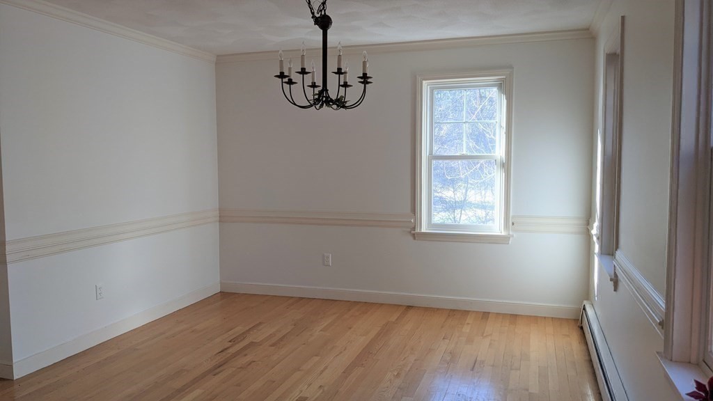 92 Lyman Road Berlin, MA 01503 - Photo 19 of 32 a view of empty room with wooden floor and fan