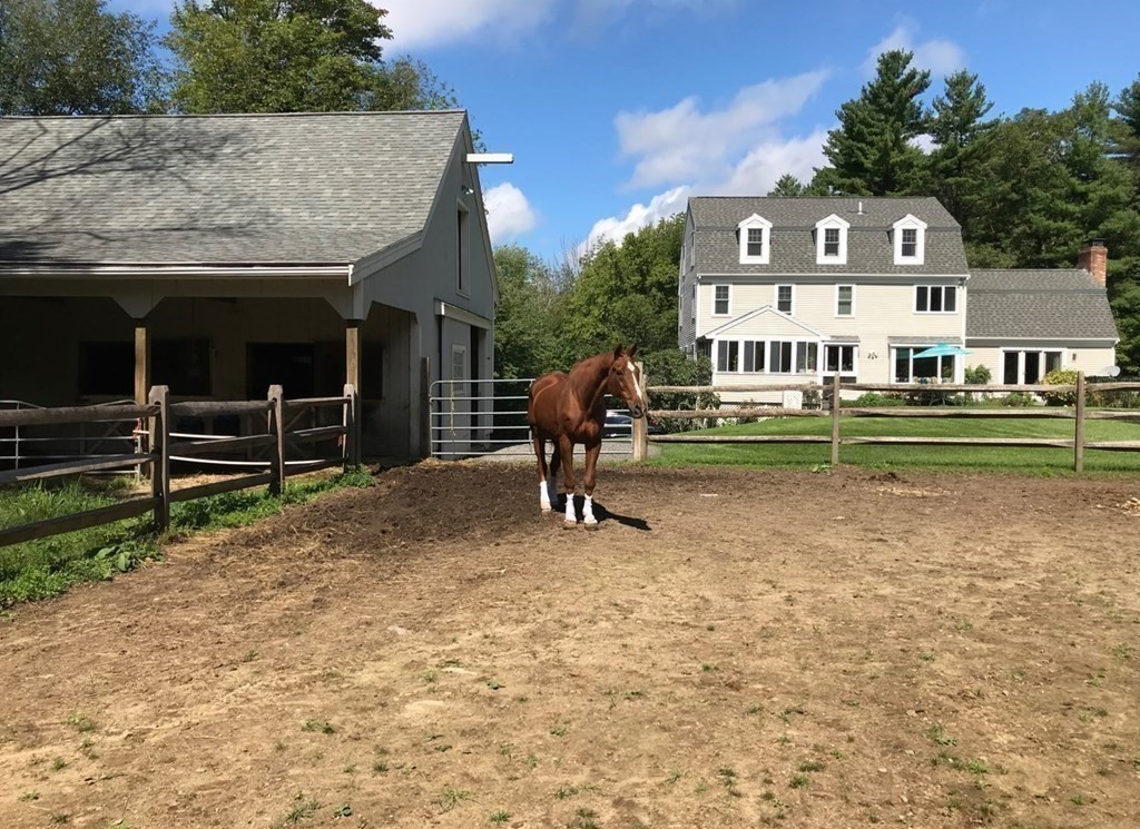 92 Lyman Road Berlin, MA 01503 - Photo 29 of 32 a front view of a house with a yard