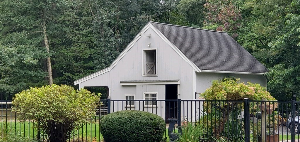 92 Lyman Road Berlin, MA 01503 - Photo 4 of 32 a front view of a house with garden