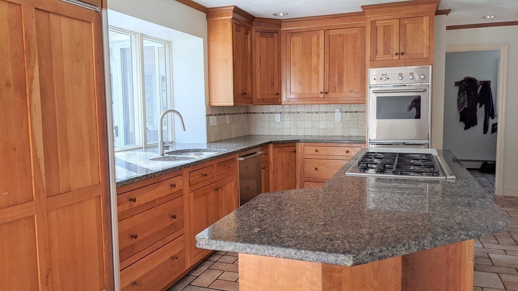 92 Lyman Road Berlin, MA 01503 - Photo 8 of 32 a kitchen with stainless steel appliances granite countertop a sink stove and refrigerator