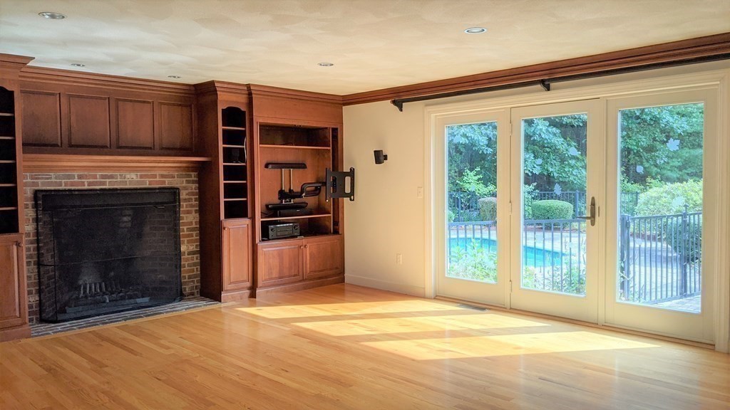 92 Lyman Road Berlin, MA 01503 - Photo 10 of 32 a view of empty room with a fireplace and fan