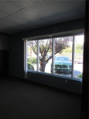 a view of an empty room with a large window