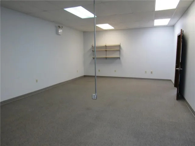 a view of a room with a refrigerator