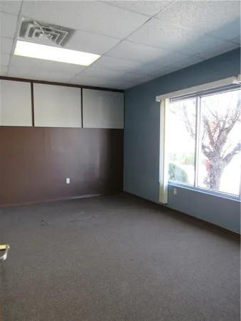 a view of an empty room with a window