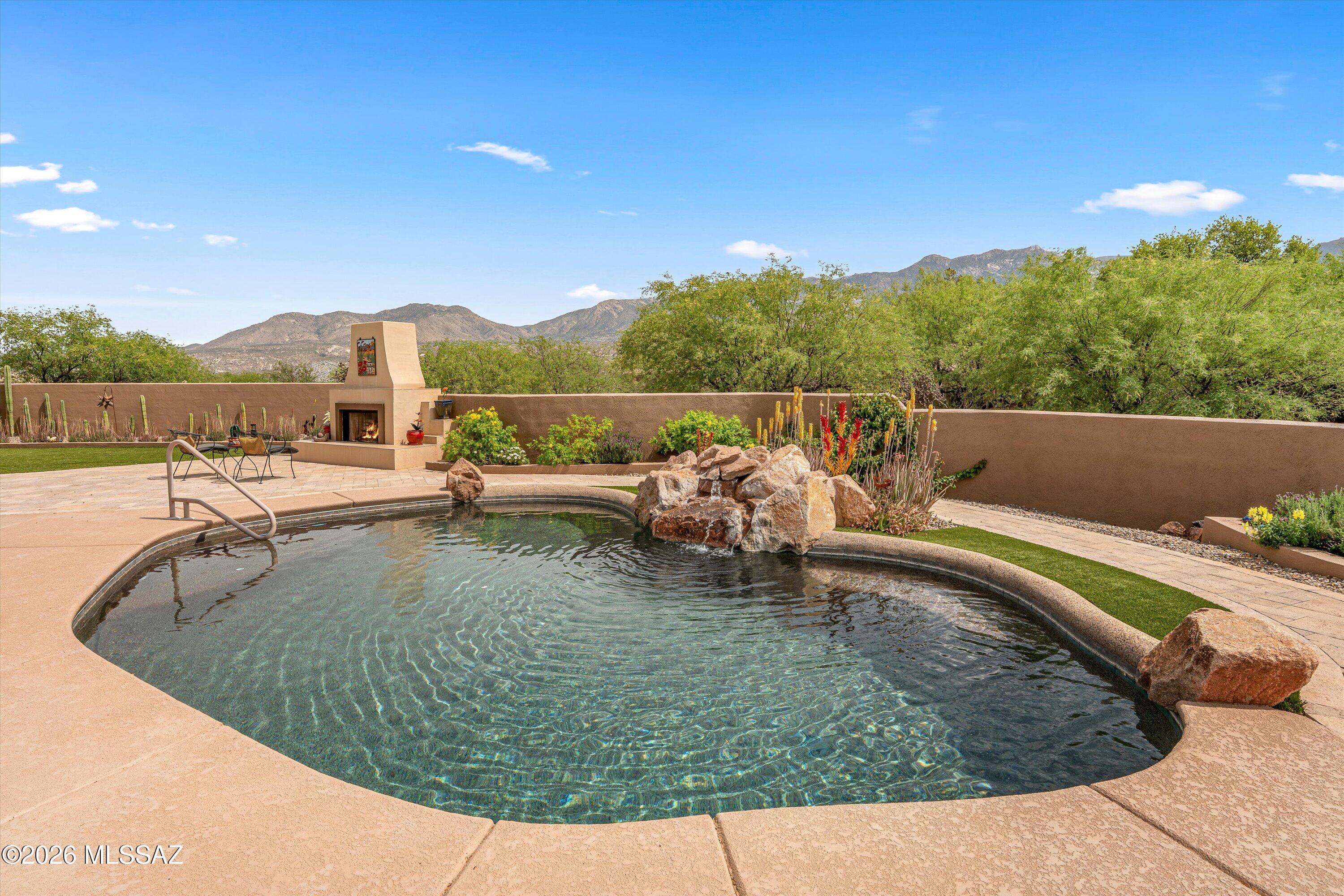 4760 East Wagon Train Road Tucson, AZ 85739 - Photo 9 of 38 a view of a swimming pool with a lake view
