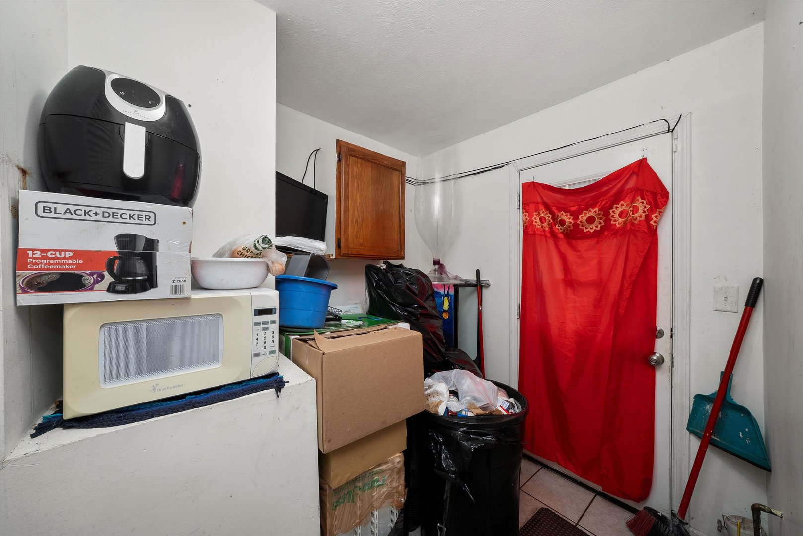 14819 Irving Avenue Dolton, IL 60419 - Photo 15 of 21 a view of a workspace with furniture and a flat screen tv