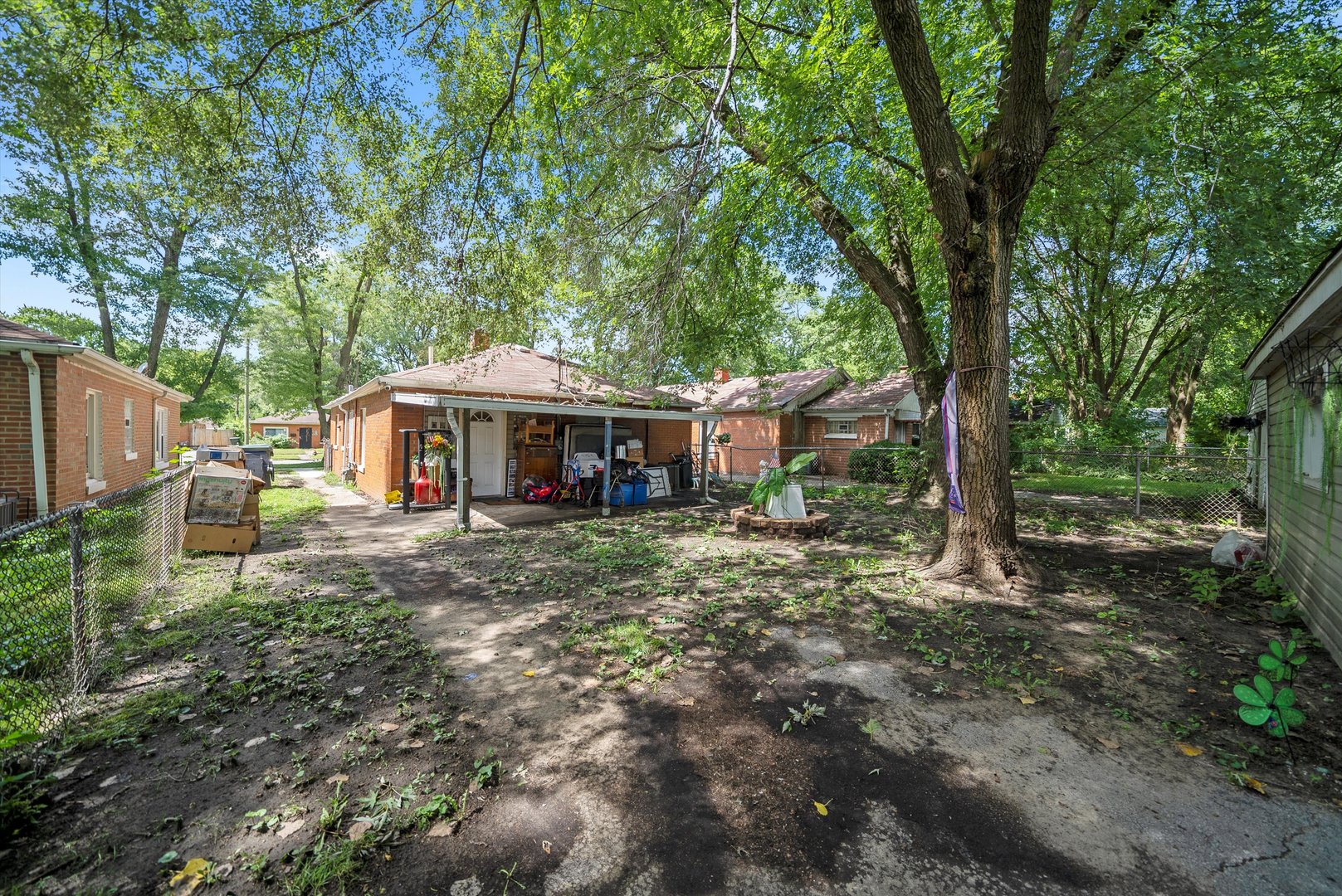 14819 Irving Avenue Dolton, IL 60419 - Photo 19 of 21 a front view of a house with yard and green space