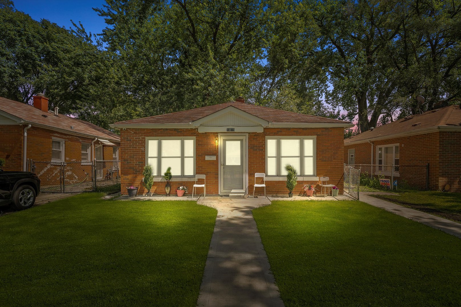14819 Irving Avenue Dolton, IL 60419 - Photo 2 of 21 a front view of a house with a garden