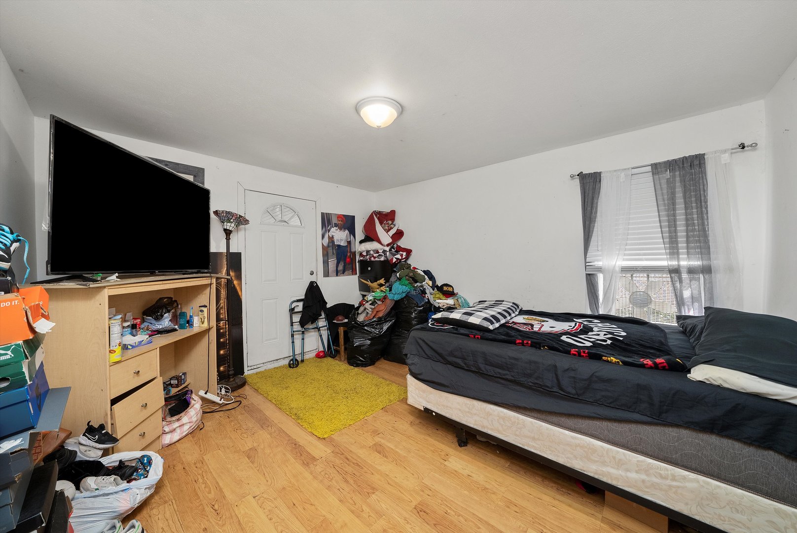 14819 Irving Avenue Dolton, IL 60419 - Photo 4 of 21 a bedroom with furniture and flat screen tv