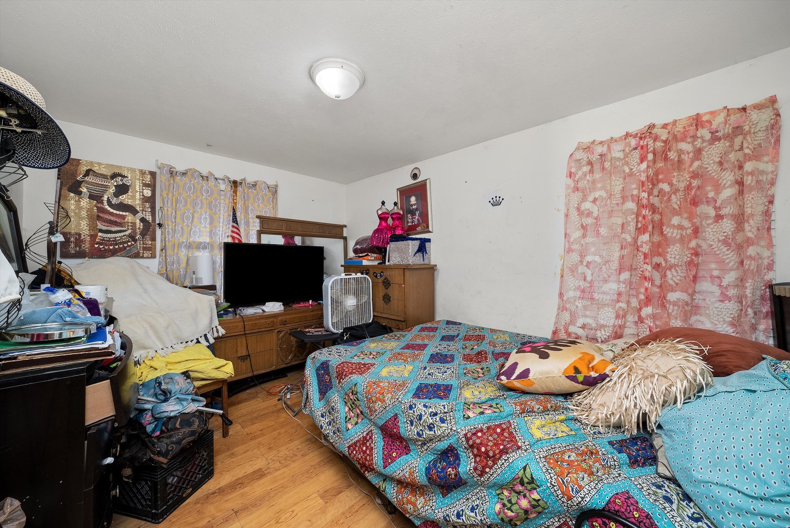 14819 Irving Avenue Dolton, IL 60419 - Photo 5 of 21 a bedroom with bed and a couch