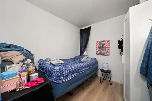 a bedroom with a bed and a dresser