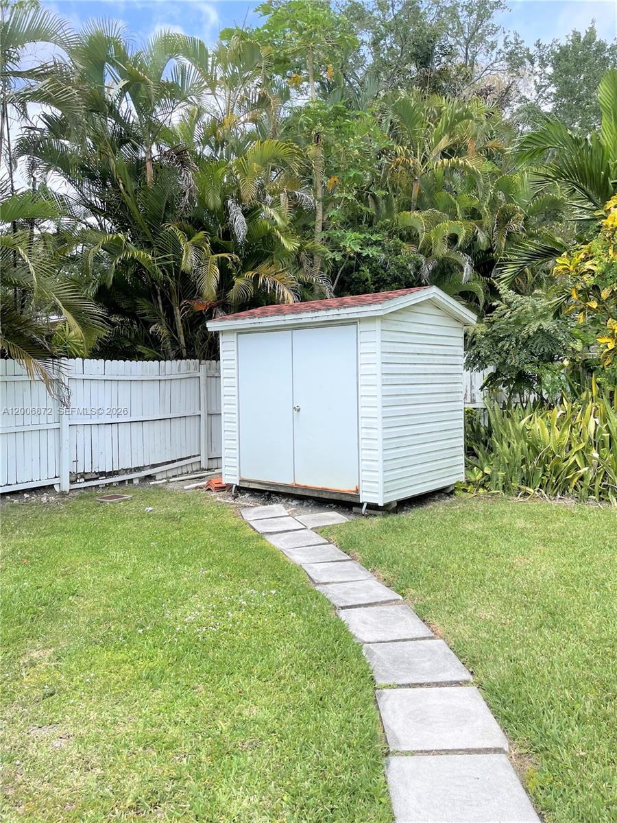 5116 Southwest 57th Avenue, Unit B Miami, FL 33155 - Photo 20 of 26 a view of a backyard with a garden