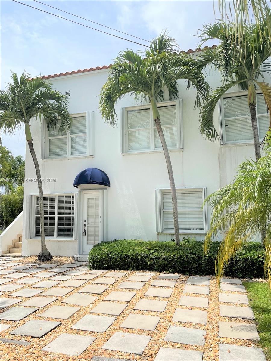 5116 Southwest 57th Avenue, Unit B Miami, FL 33155 - Photo 2 of 26 a front view of a house with a yard