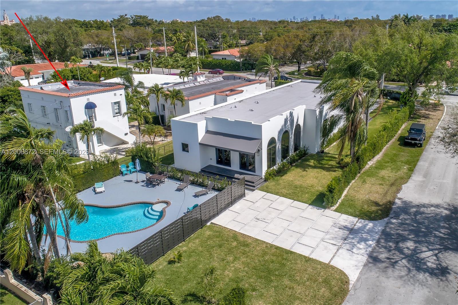 5116 Southwest 57th Avenue, Unit B Miami, FL 33155 - Photo 3 of 26 an aerial view of residential houses with outdoor space and trees