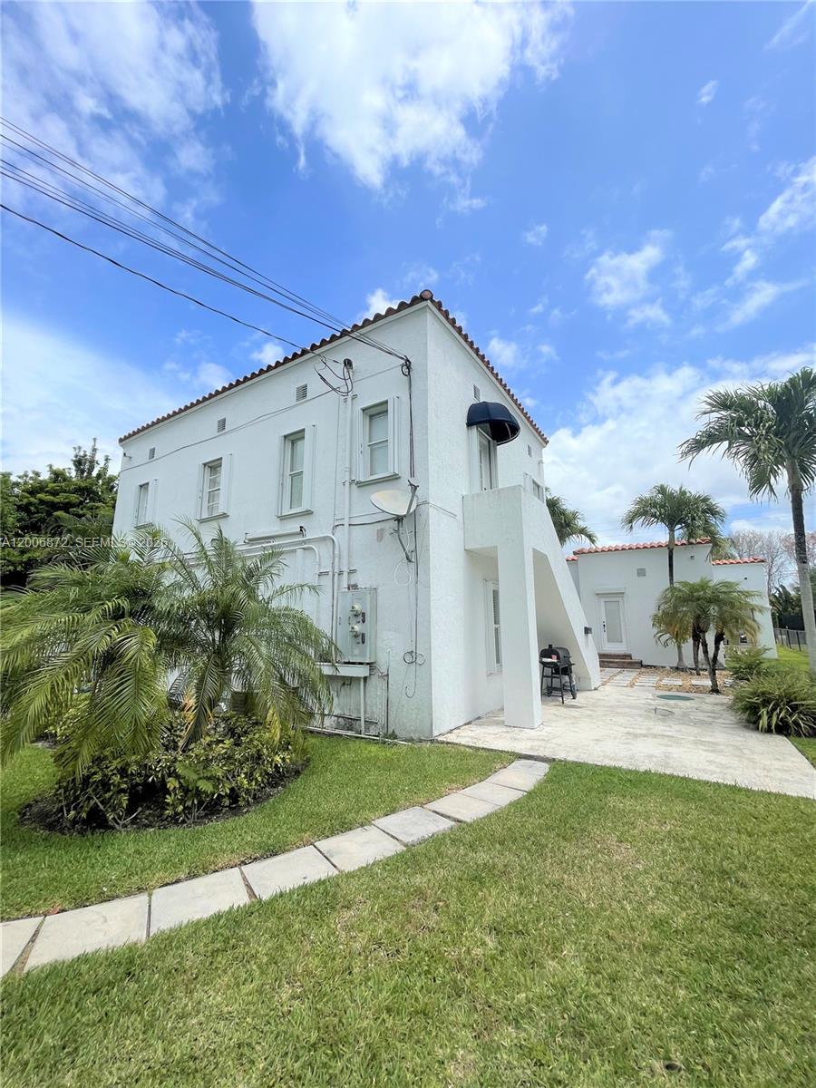 5116 Southwest 57th Avenue, Unit B Miami, FL 33155 - Photo 4 of 26 a front view of a house with garden