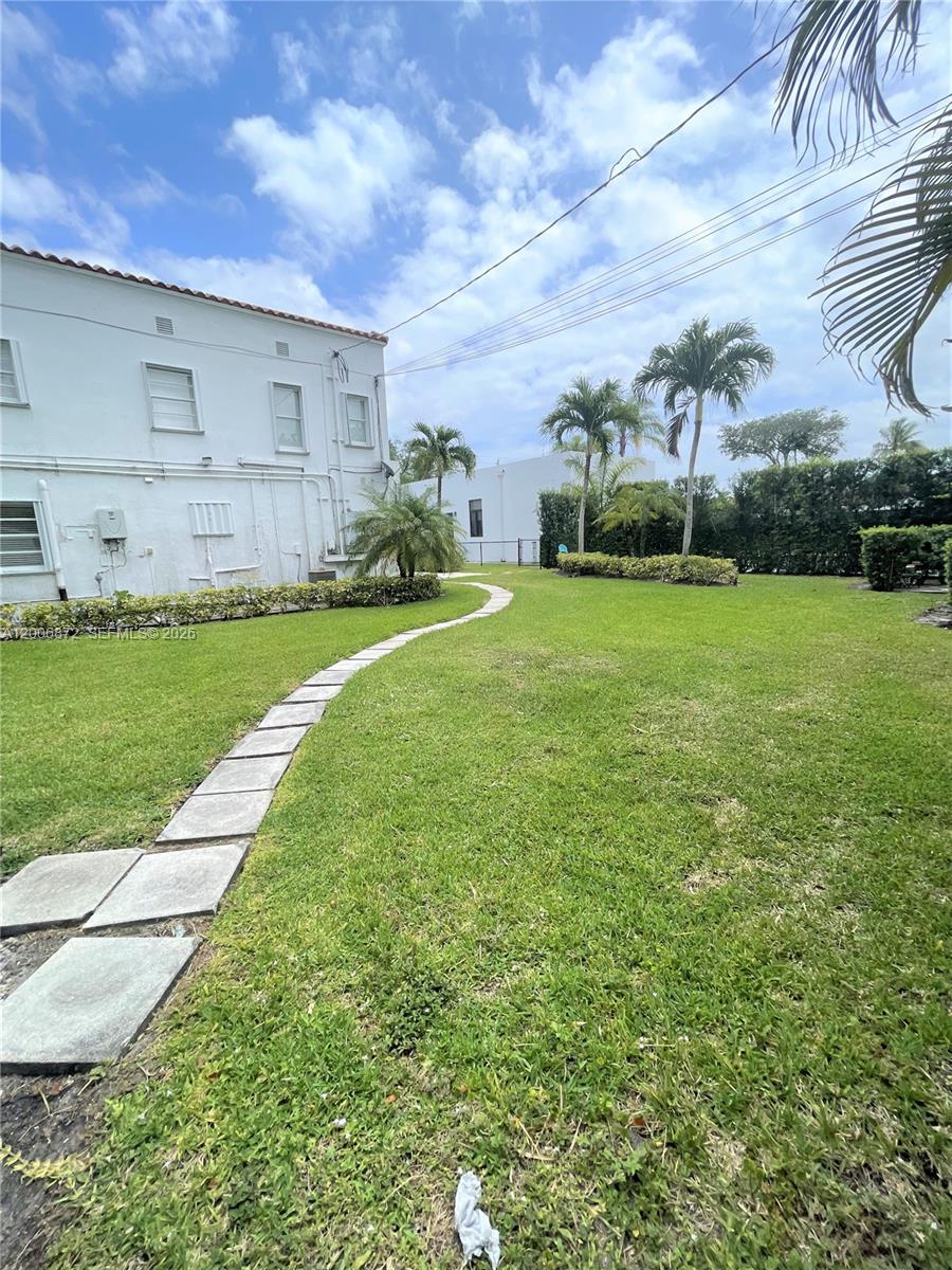 5116 Southwest 57th Avenue, Unit B Miami, FL 33155 - Photo 5 of 26 a view of a backyard with sitting area