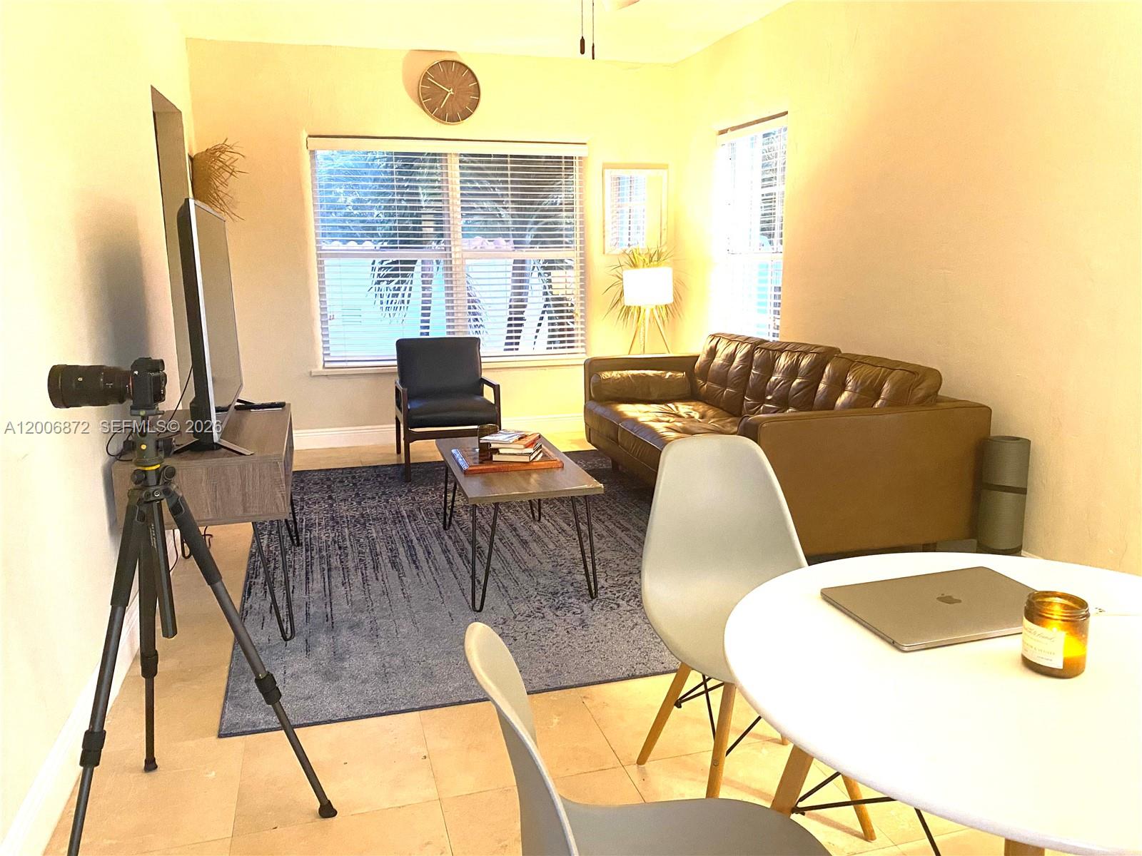 5116 Southwest 57th Avenue, Unit B Miami, FL 33155 - Photo 8 of 26 a view of a dining room with furniture and a large window