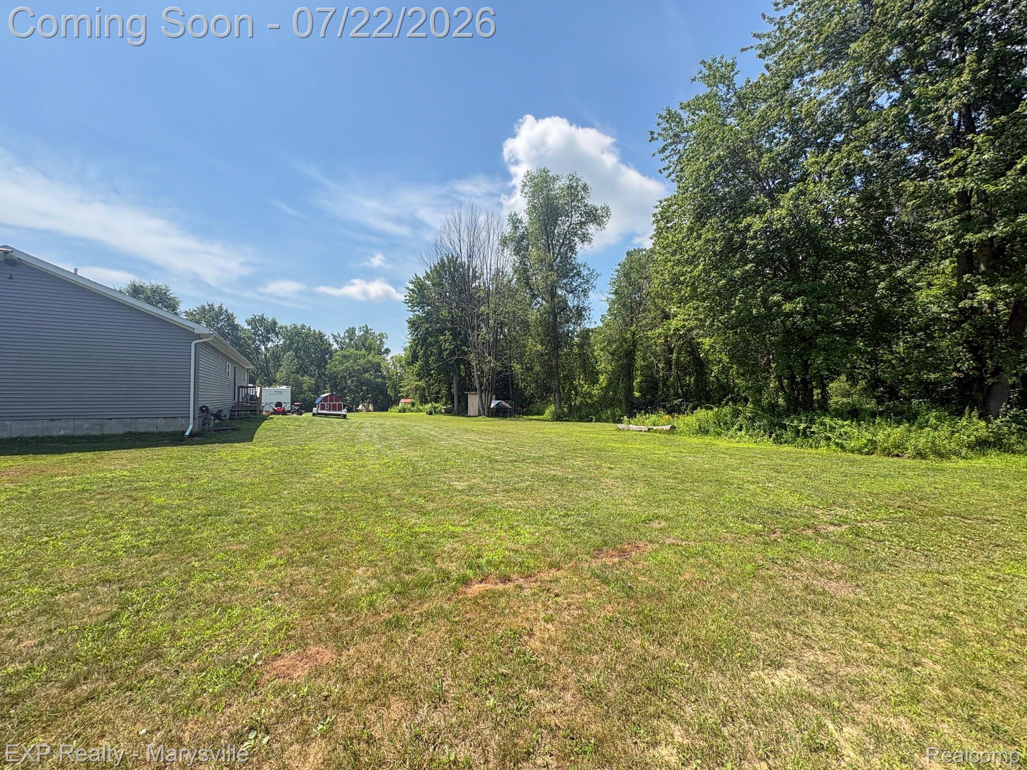 2601 Beach Road Port Huron, MI 48060 - Photo 30 of 34 Expansive grassy yard with mature perimeter trees
