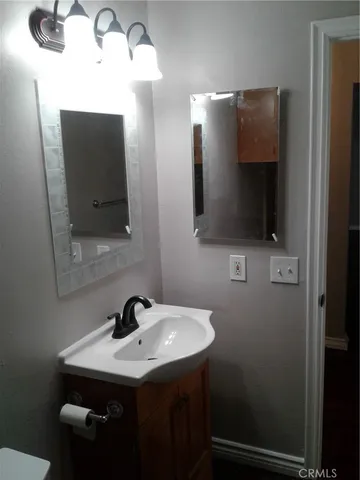 a bathroom with a sink and mirror