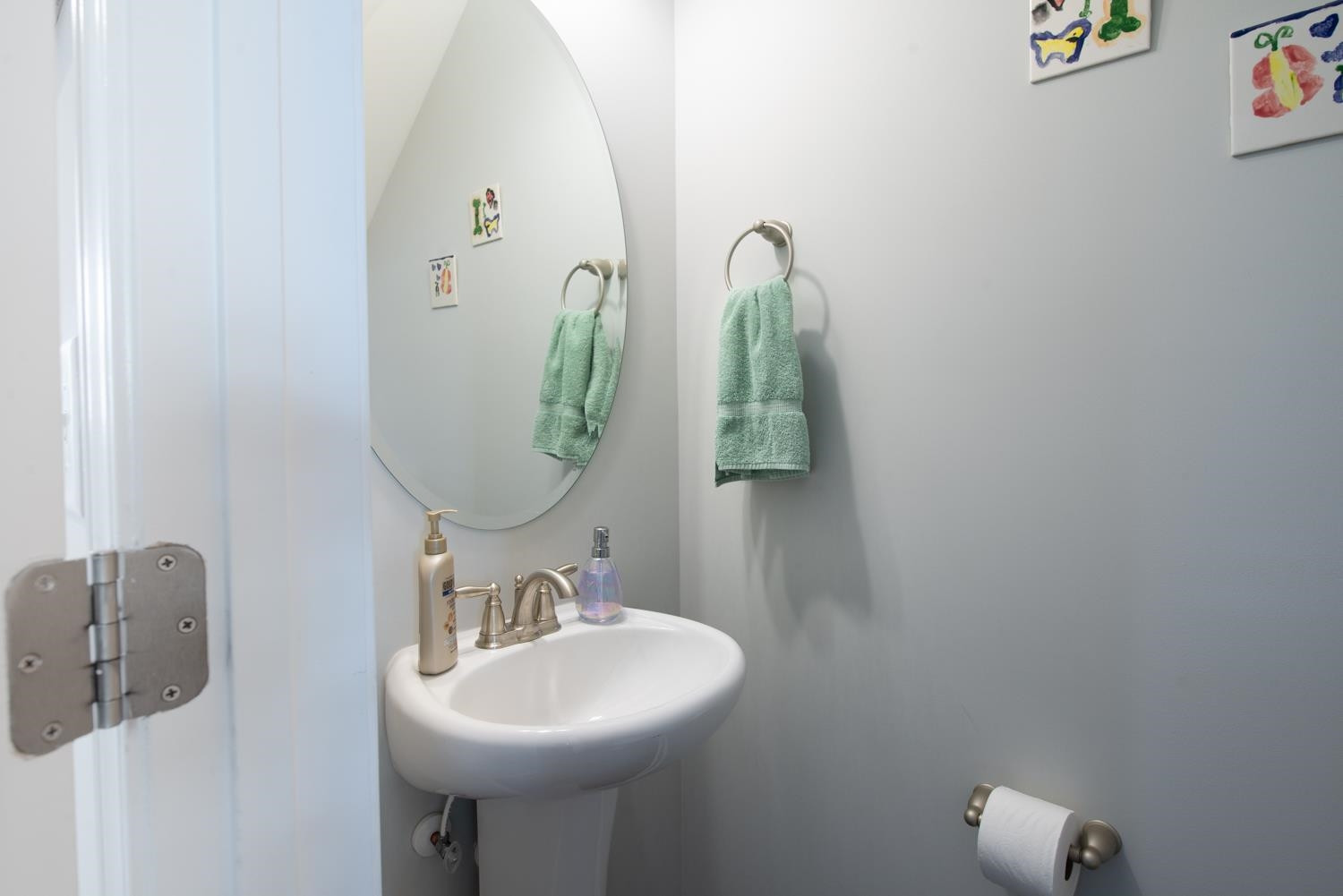 52 Principal Way Clayton, NC 27520 - Photo 13 of 31 a bathroom with a sink and mirror
