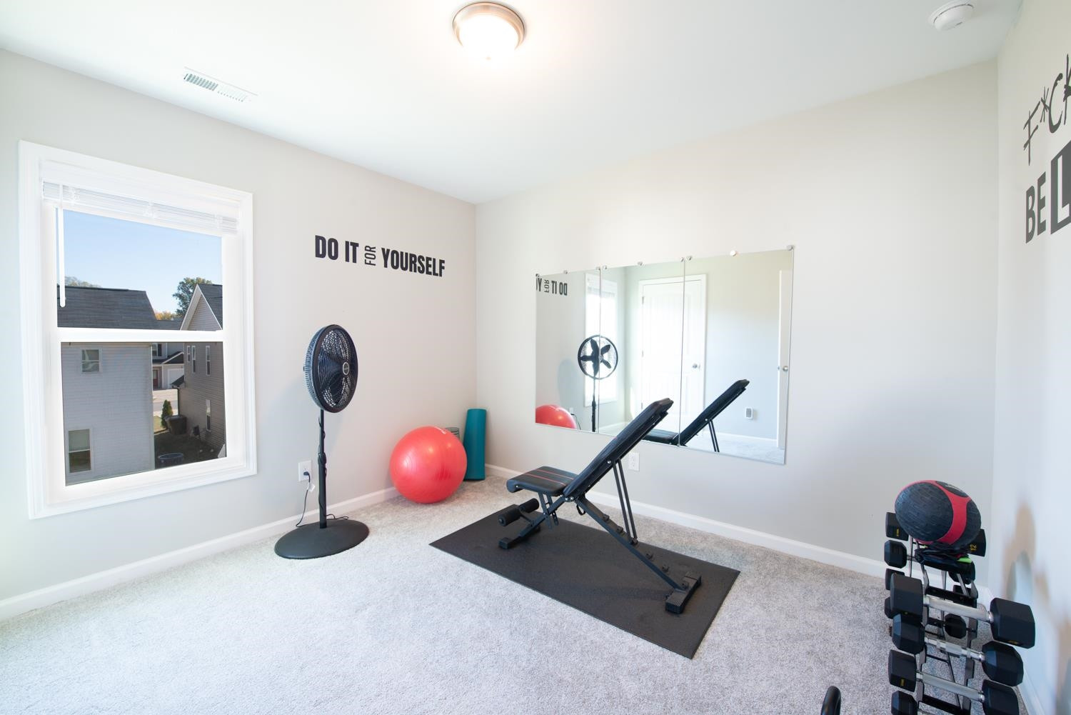 52 Principal Way Clayton, NC 27520 - Photo 18 of 31 a view of a room with gym equipment