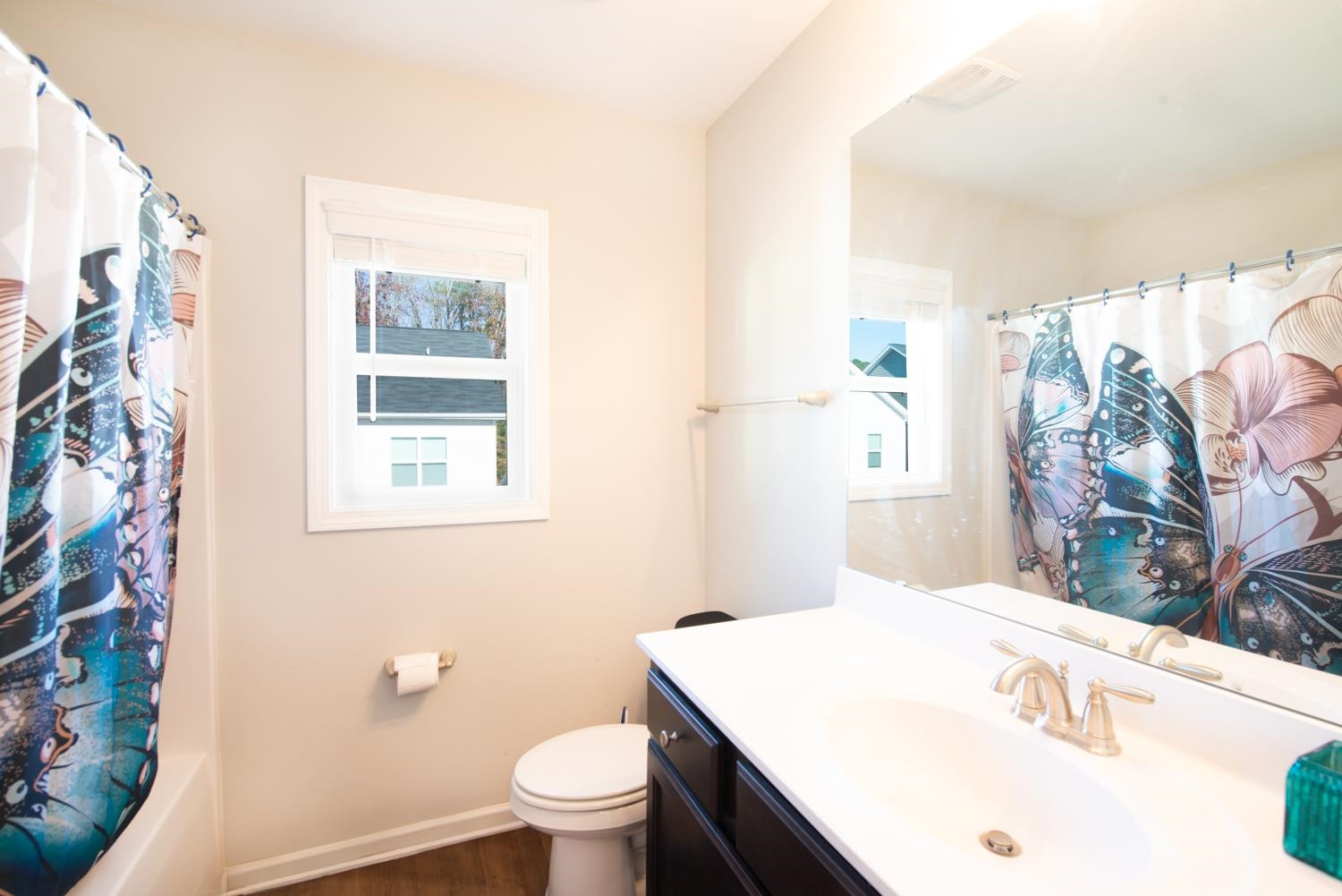 52 Principal Way Clayton, NC 27520 - Photo 20 of 31 a bathroom with a sink a toilet and a window