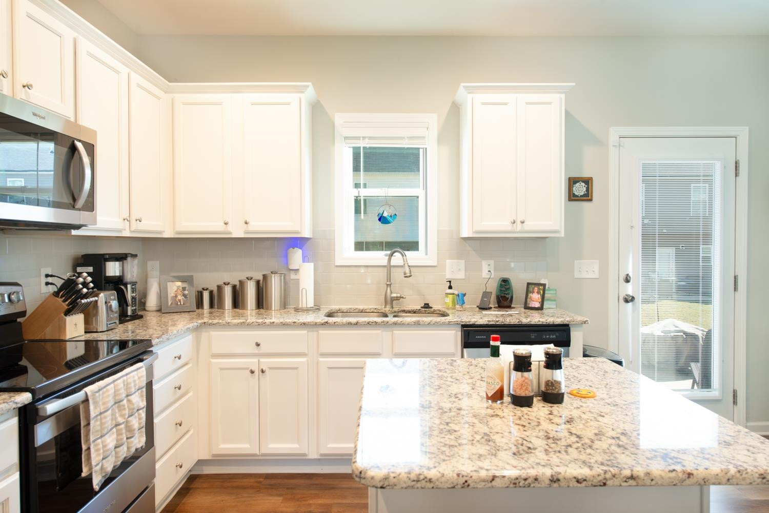 52 Principal Way Clayton, NC 27520 - Photo 5 of 31 a kitchen with stainless steel appliances granite countertop a sink and cabinets