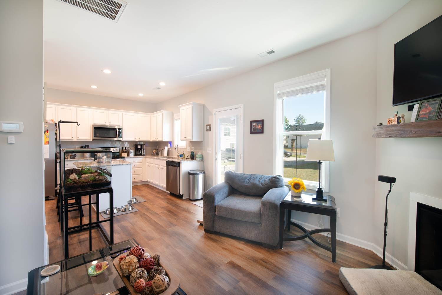 52 Principal Way Clayton, NC 27520 - Photo 10 of 31 a living room with furniture and a flat screen tv