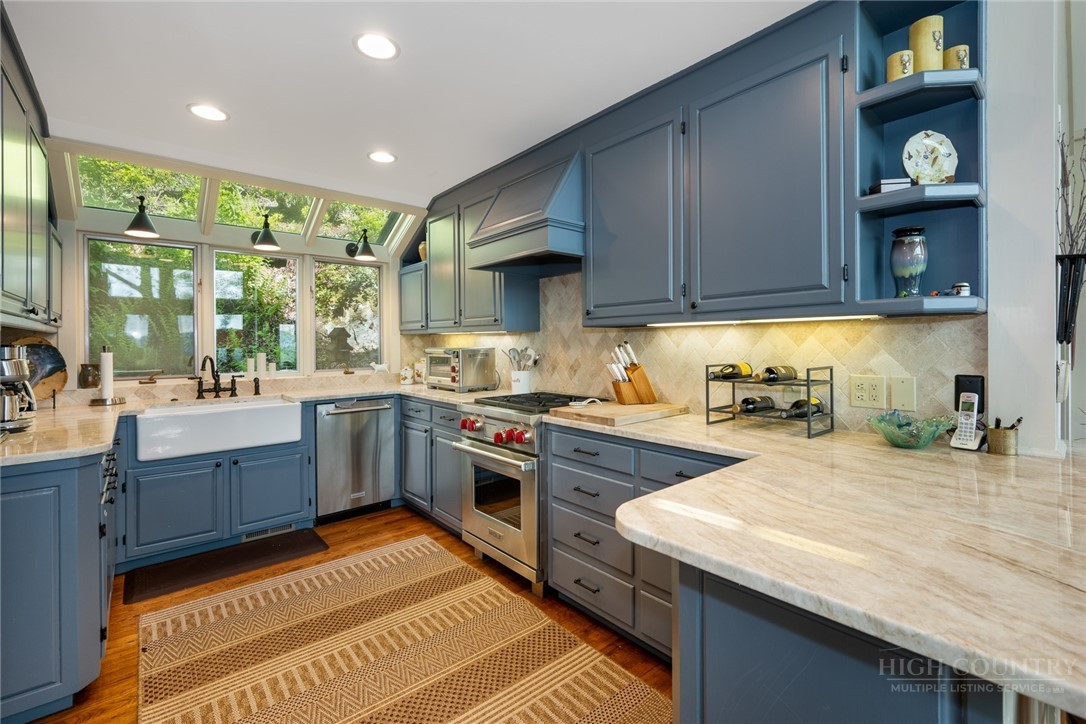 246 Mulberry Lane Boone, NC 28607 - Photo 23 of 49 a kitchen with sink cabinets and stove
