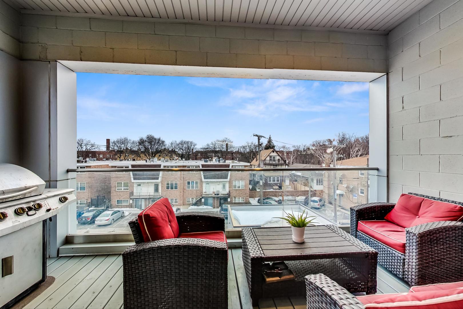 4042 North Pulaski Road, Unit 3W Chicago, IL 60641 - Photo 11 of 33 a view of a balcony with furniture and a fireplace