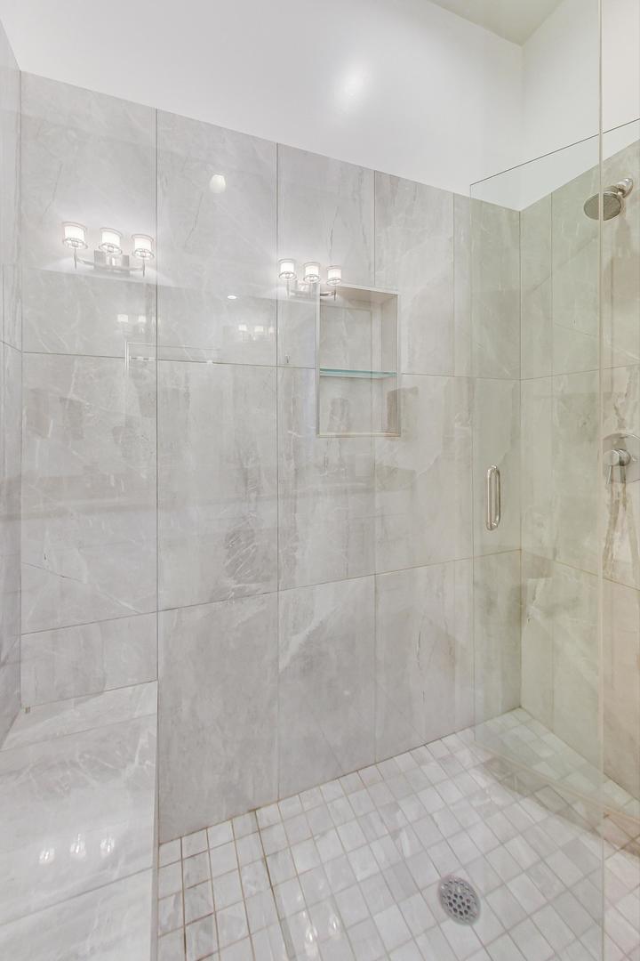 4042 North Pulaski Road, Unit 3W Chicago, IL 60641 - Photo 17 of 33 a bathroom with a shower