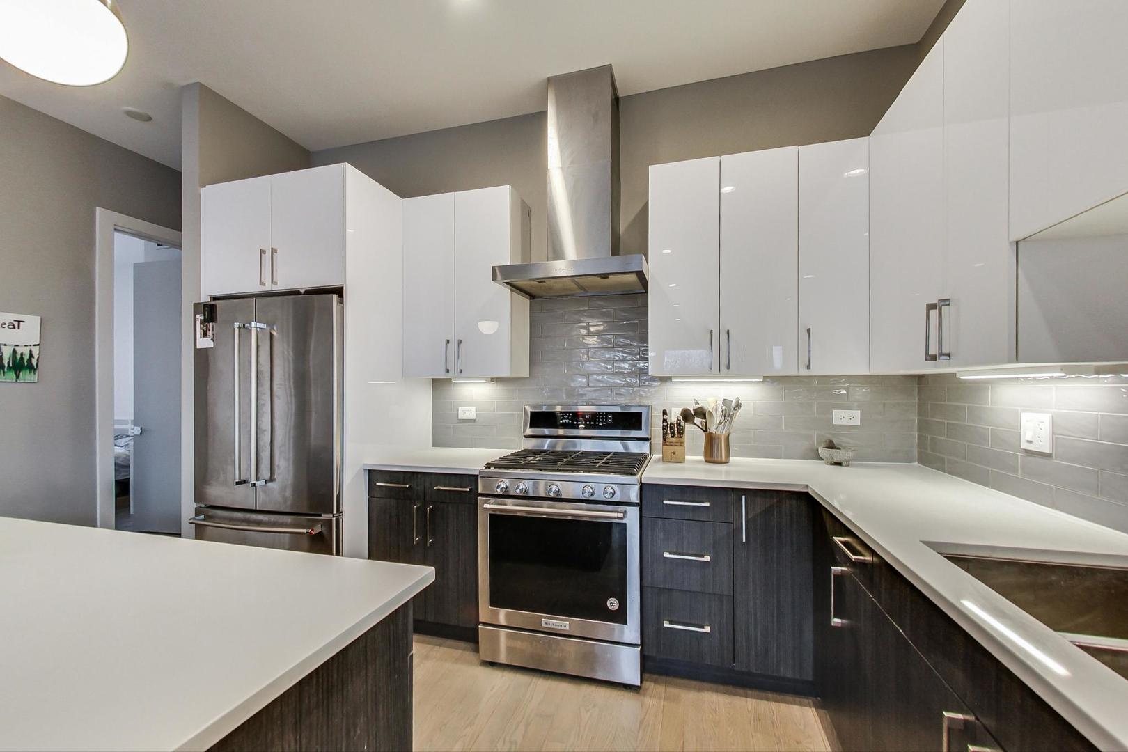 4042 North Pulaski Road, Unit 3W Chicago, IL 60641 - Photo 2 of 33 a kitchen with cabinets and appliances