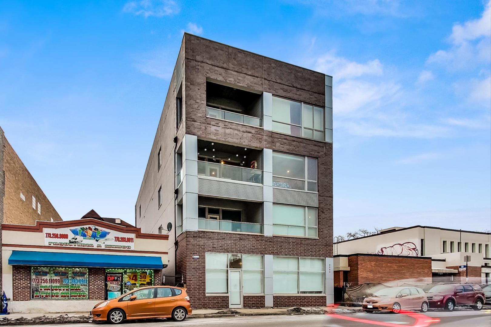 4042 North Pulaski Road, Unit 3W Chicago, IL 60641 - Photo 32 of 33 a front view of a building with parking space