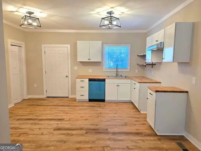 a view of a kitchen with a sink