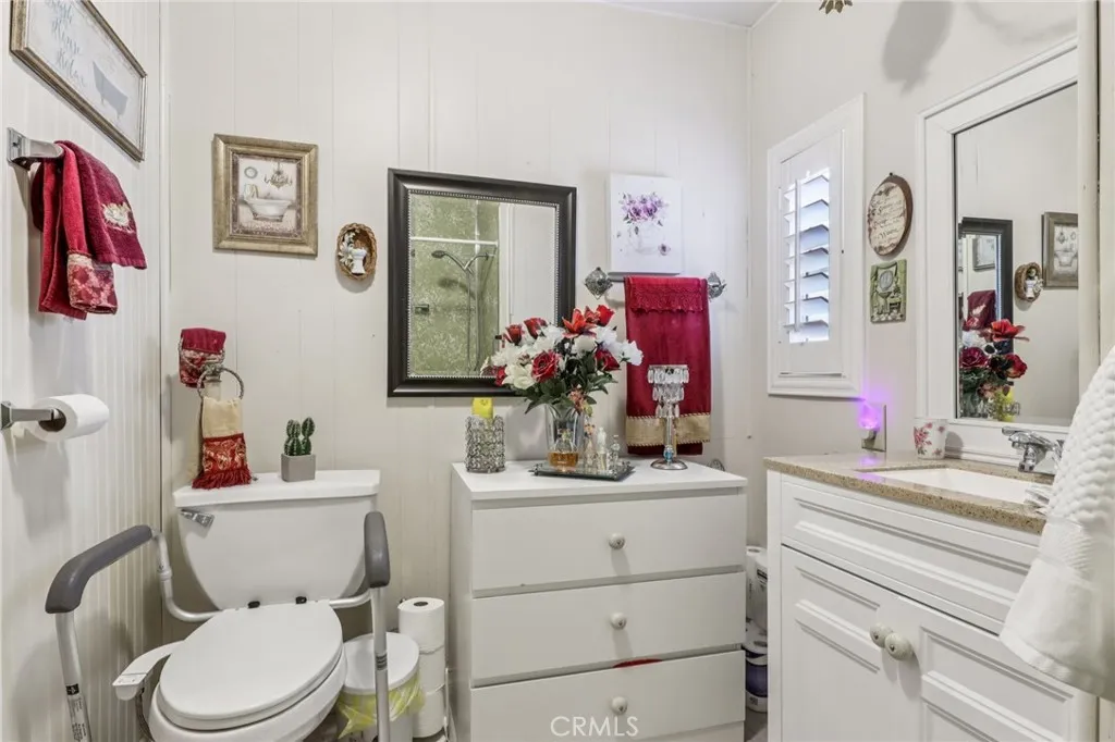 3700 Buchanan Street, Unit 28 Riverside, CA 92503 - Photo 22 of 35 a bathroom with a sink vanity mirror and toilet