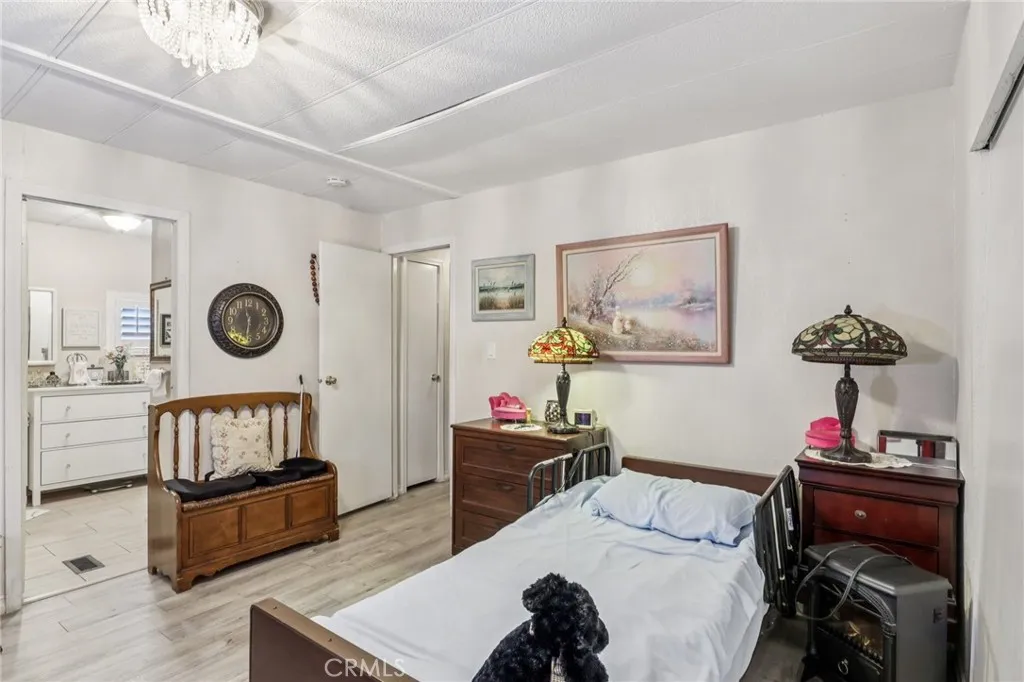 3700 Buchanan Street, Unit 28 Riverside, CA 92503 - Photo 26 of 35 a bedroom with furniture and a window