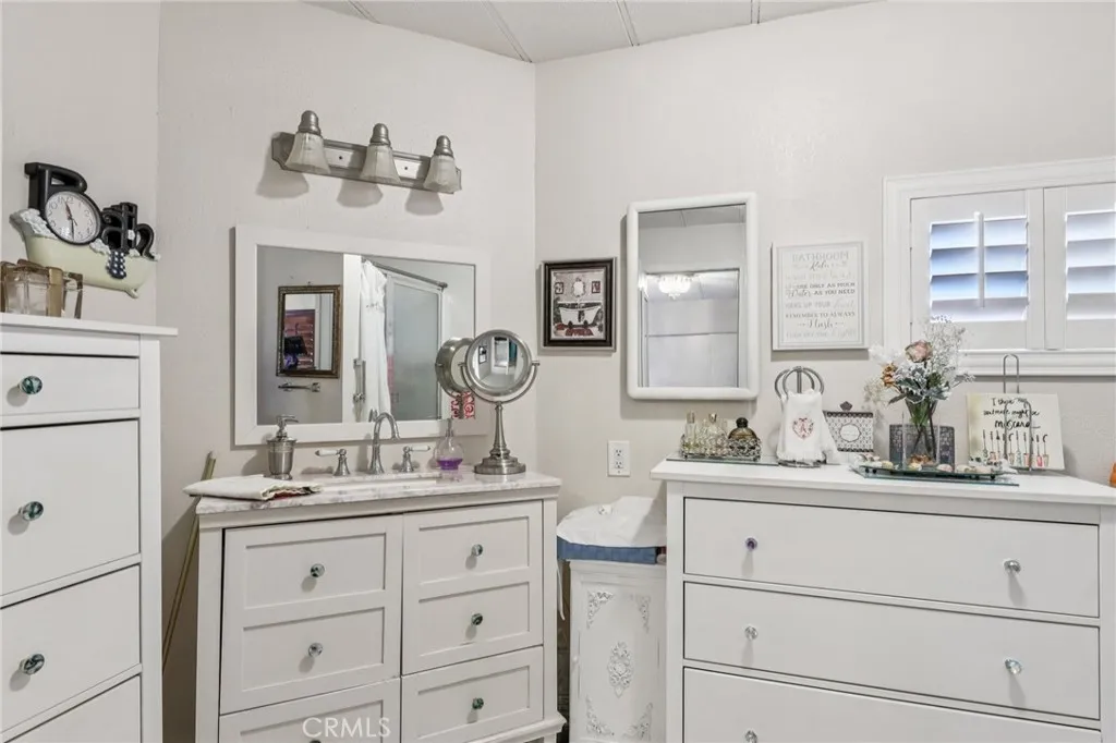 3700 Buchanan Street, Unit 28 Riverside, CA 92503 - Photo 29 of 35 a bathroom with a double vanity sink mirror and
